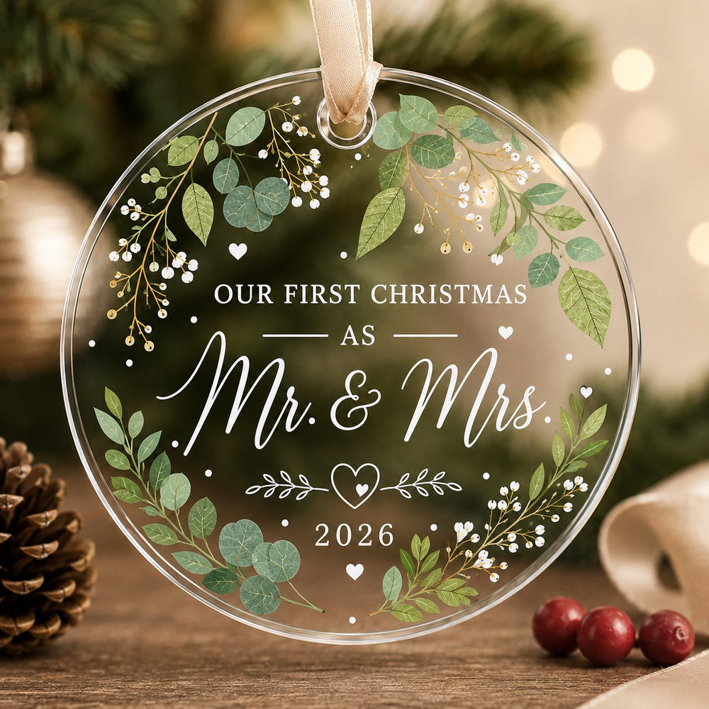 Clear round wedding ornament with foliage, flowers, hearts and Our First Christmas As Mr. and Mrs. wording